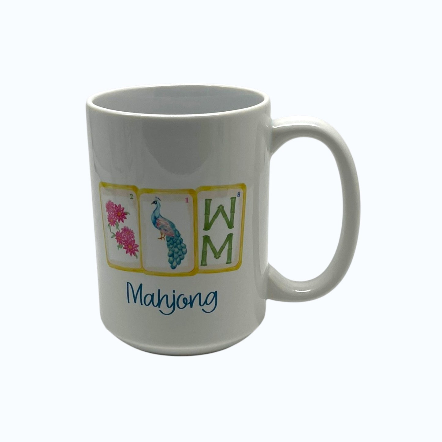 Petals and Plumes Mahjong 15 ounce white mug with pink floral blue peacock green tile artwork and blue Mahjong script