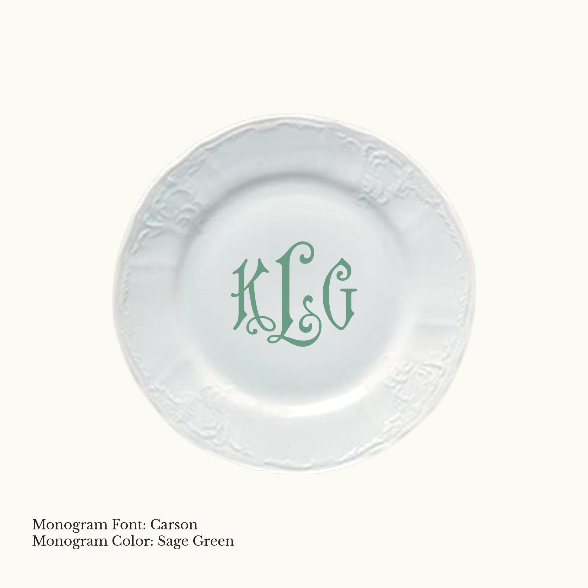 White 6¾-inch Bernadotte porcelain bread and butter plate with an embossed rim and Carson three-letter monogram in Sage Green.