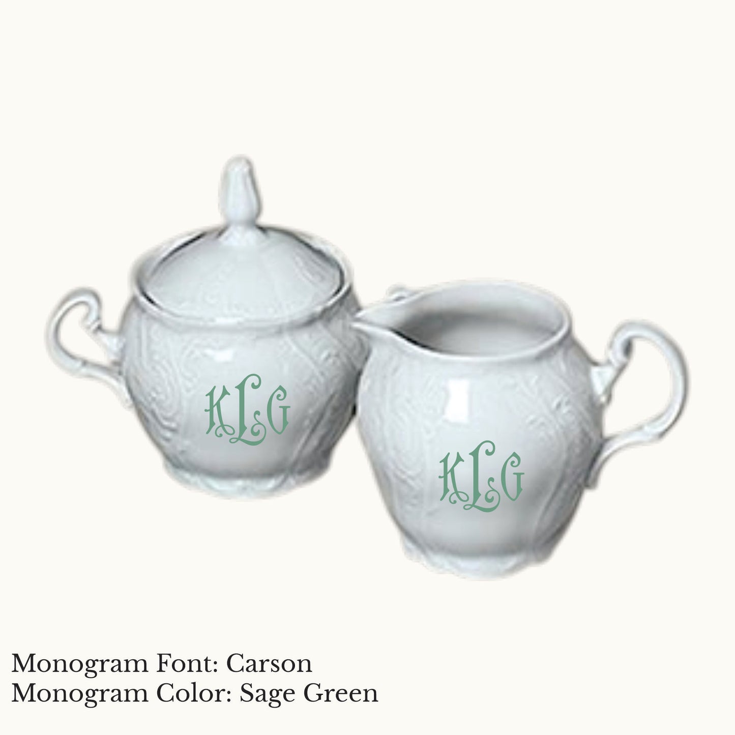 White Bernadotte porcelain cream and sugar set with embossed detailing and Carson three-letter monograms in Sage Green.