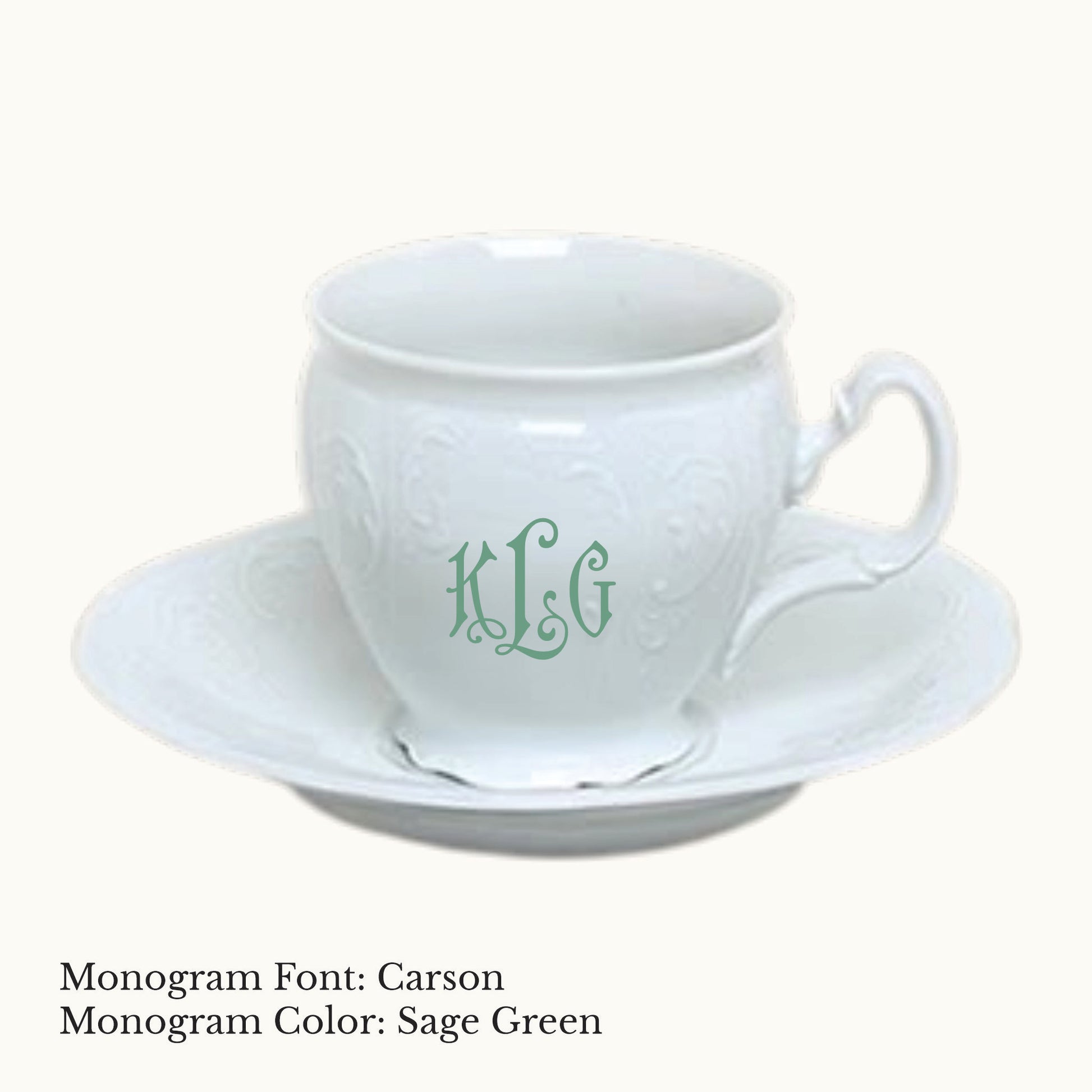 White Bernadotte porcelain cup and saucer with embossed detailing and a Carson three-letter monogram in Sage Green.