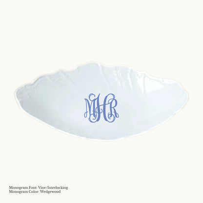 White 13¼-inch Bernadotte oval porcelain bread basket with embossed detailing and an interlocking three-letter monogram in Wedgwood blue.