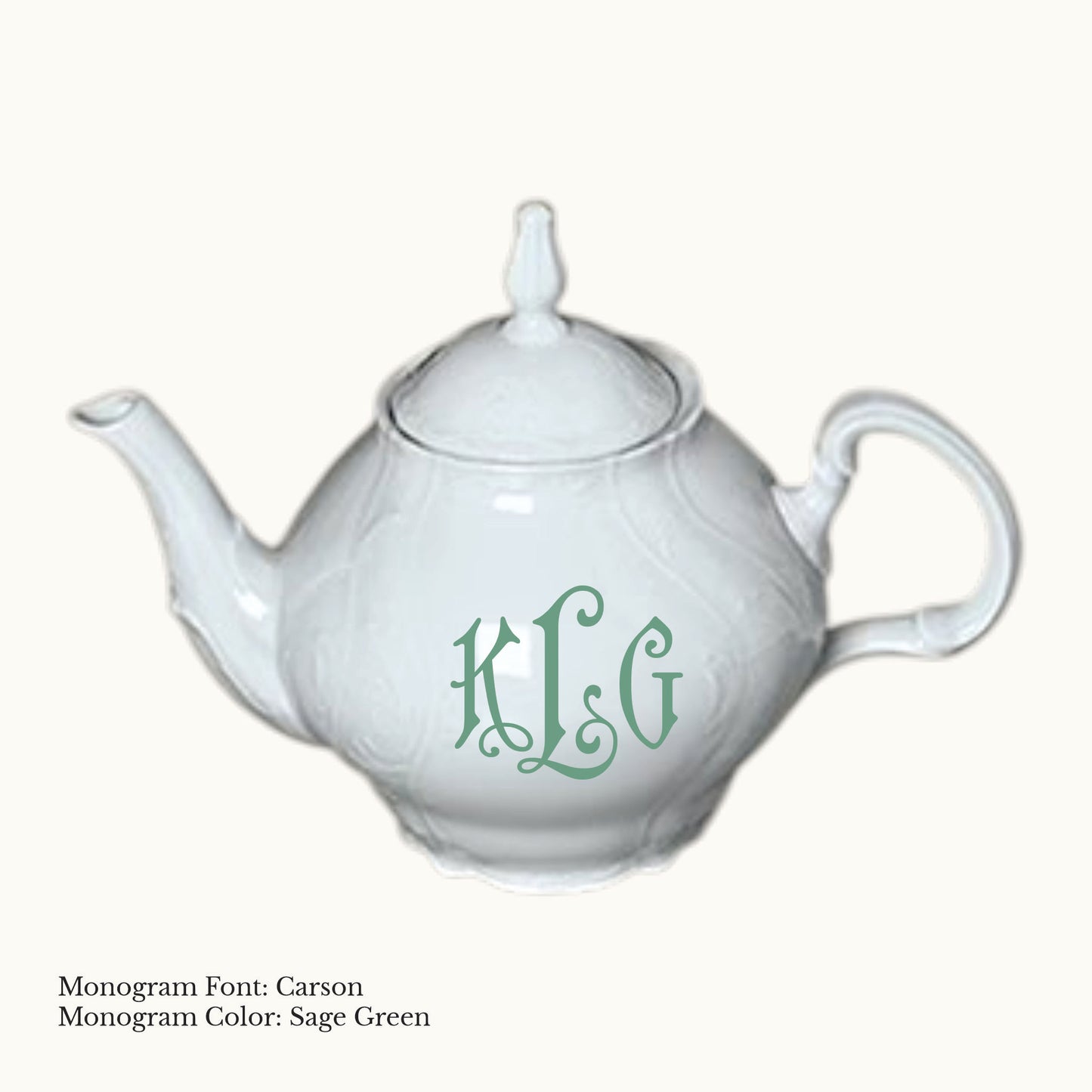White 40-ounce Bernadotte porcelain teapot with embossed detailing, coordinating lid, and a Carson three-letter monogram in Sage Green.