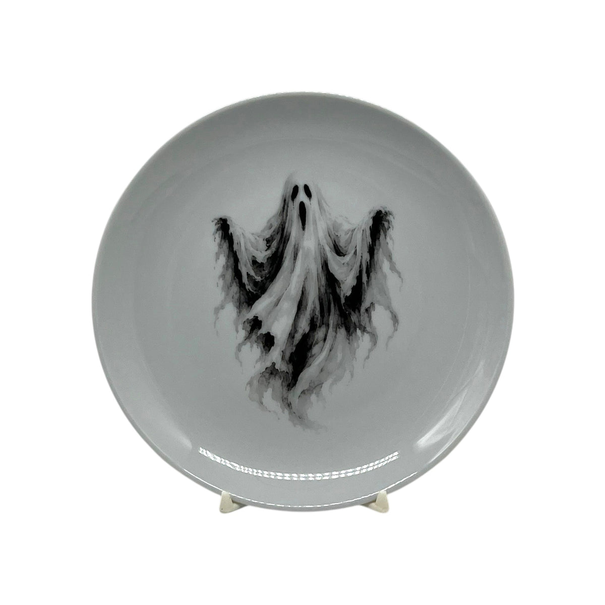 Haunted Spirit 6.25 inch Halloween coupe plate with flowing black-and-white ghost artwork