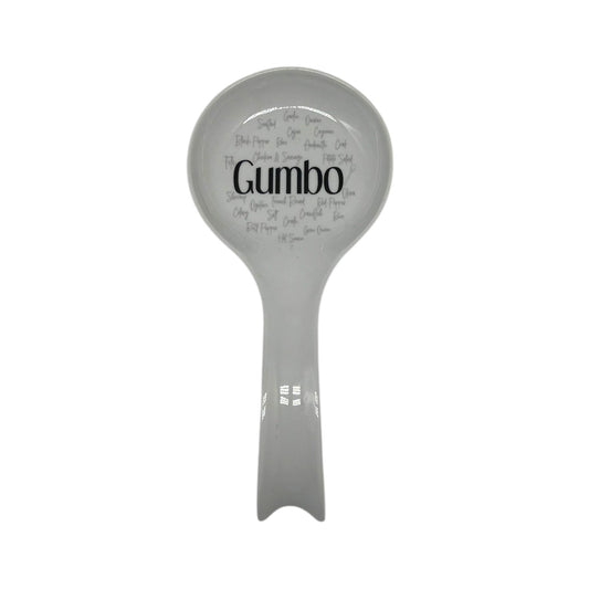 Gumbo Roux to Rice white spoon rest featuring bold black Gumbo lettering surrounded by Louisiana gumbo ingredient words