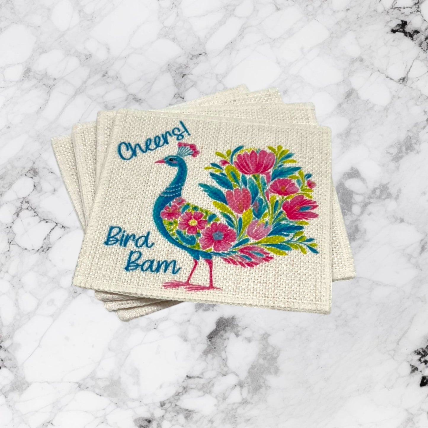 Fancy Bird Bam Mahjong linen coaster set of four with colorful turquoise pink and green floral bird artwork and Cheers lettering