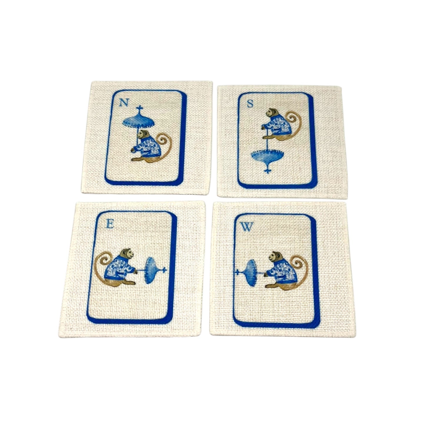 The Four Winds Mahjong linen coaster set of four featuring North South East and West chinoiserie monkeys in blue on natural linen