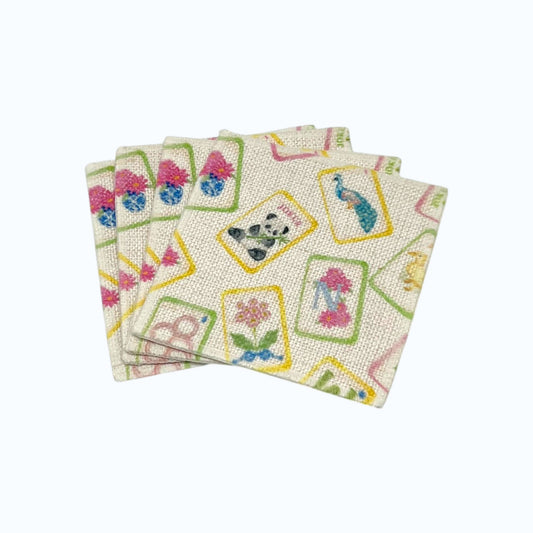 Petals and Plumes Mahjong linen coaster set of four featuring colorful floral peacock panda and mahjong tile artwork