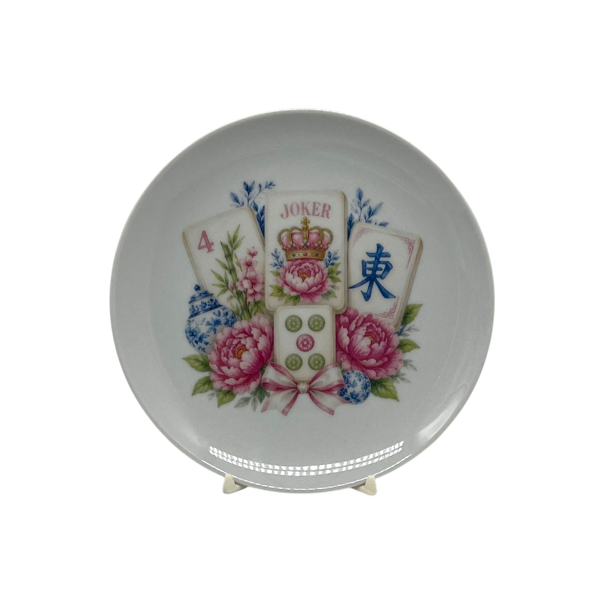 Royal Mahjong Garden 6.25 inch coupe plate with crowned Joker mahjong tiles, pink peonies and blue-and-white chinoiserie accents