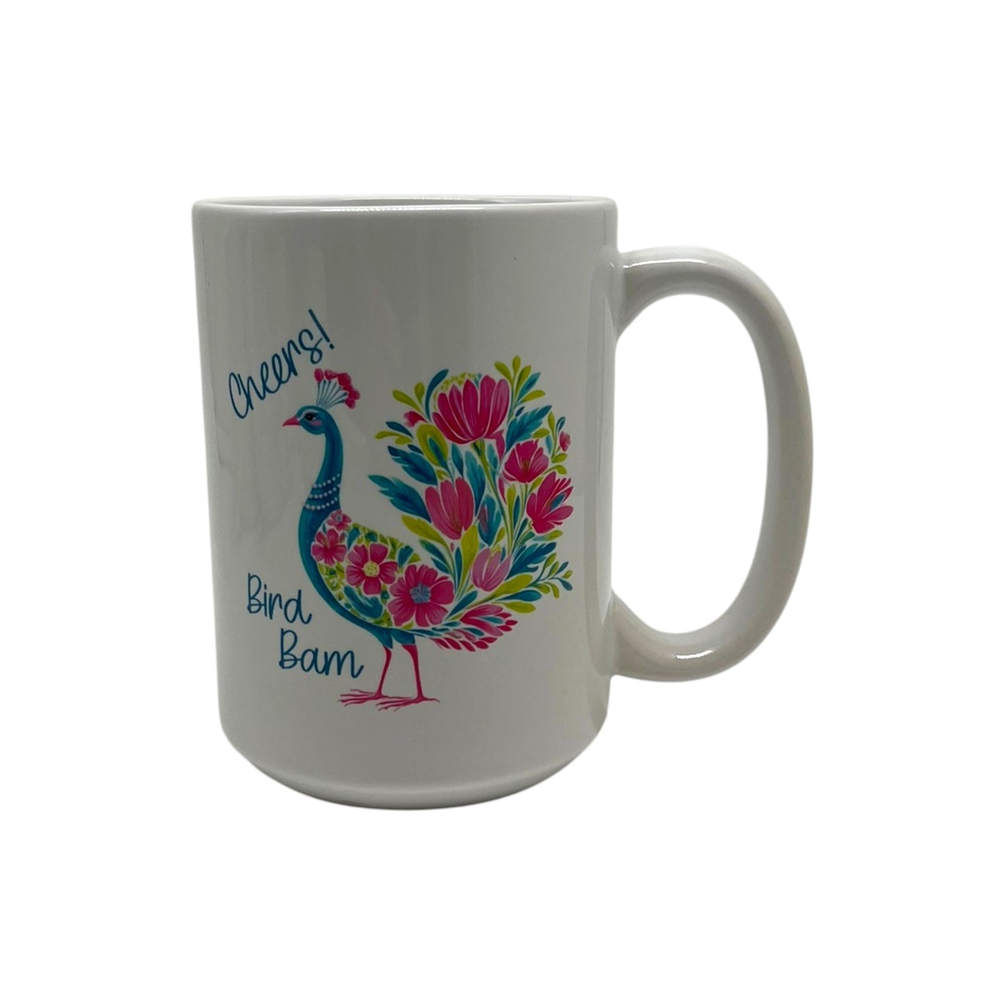 Fancy Bird Bam Mahjong 15 ounce white mug with colorful floral peacock-inspired bird, Cheers lettering and Bird Bam design